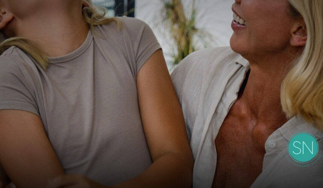 Mother and daughter talking about life insurance options.